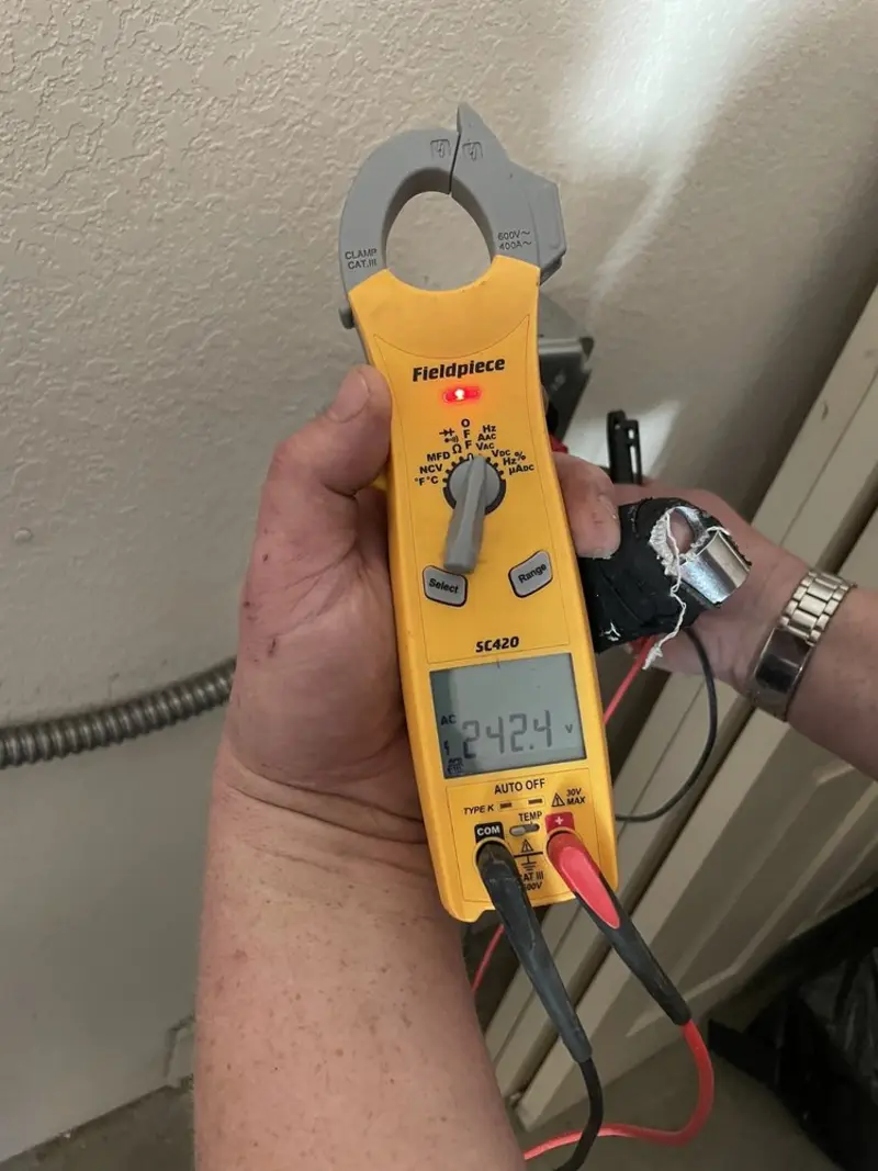 Voltage testing with clamp meter during Ceiling Fan Installation in Half Moon Bay